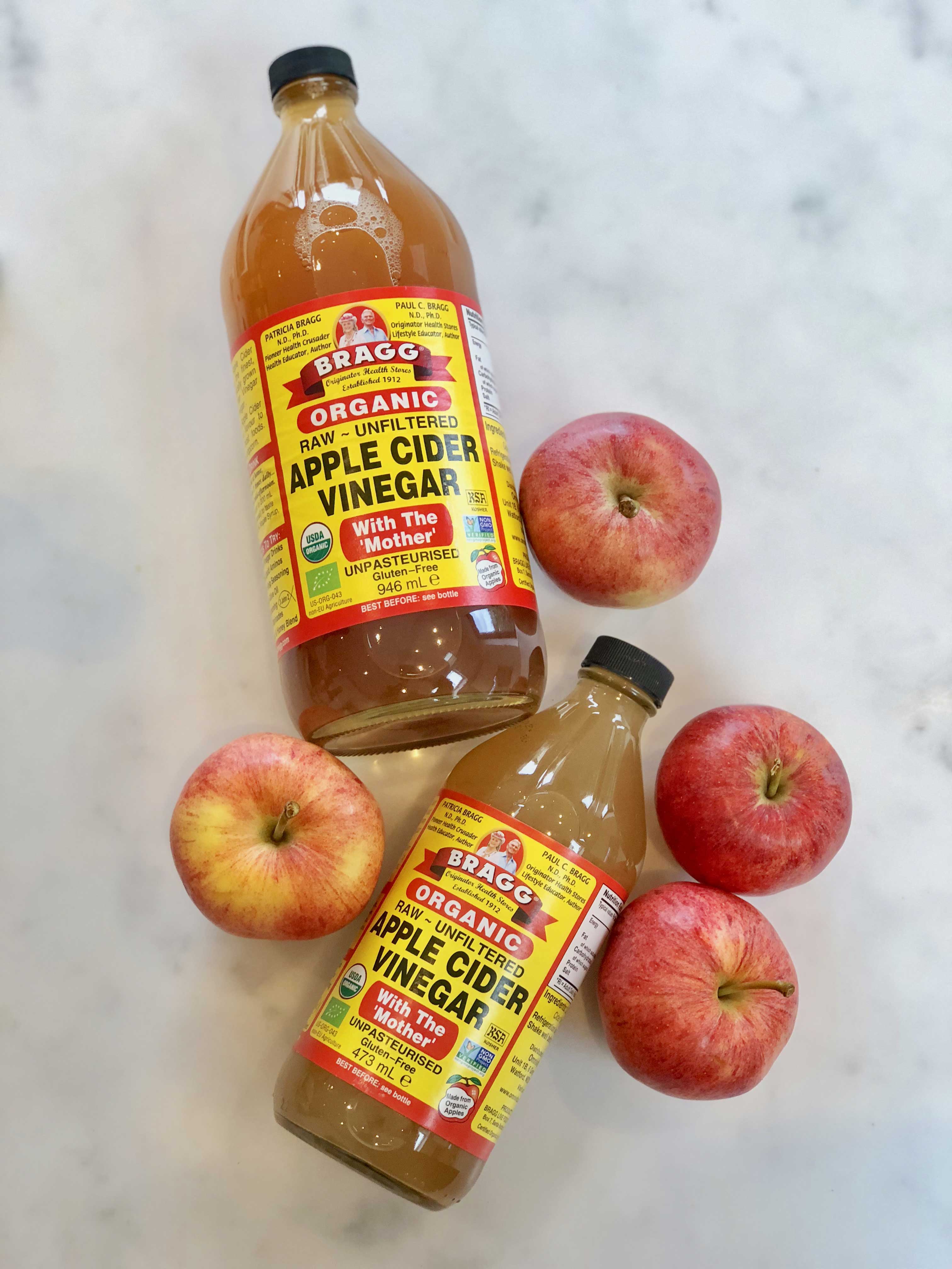 Bragg Apple Cider Vinegar with some apples 